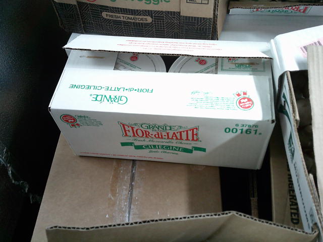 Box of two tubs of mozzarella cheese.